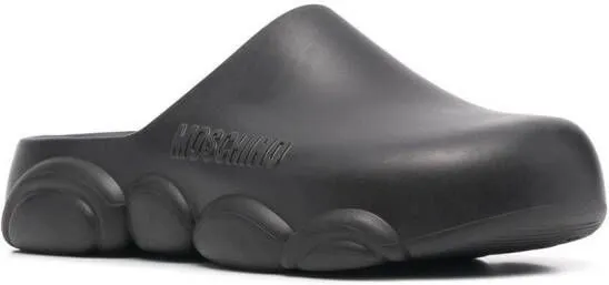 Moschino logo embossed mules Black