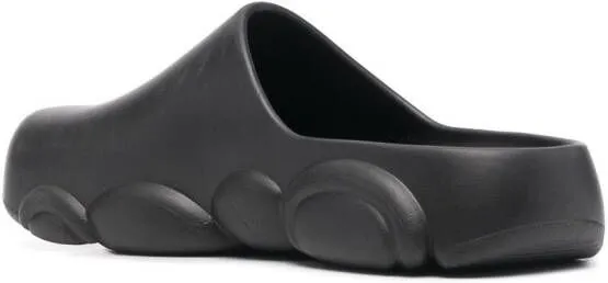 Moschino logo embossed mules Black